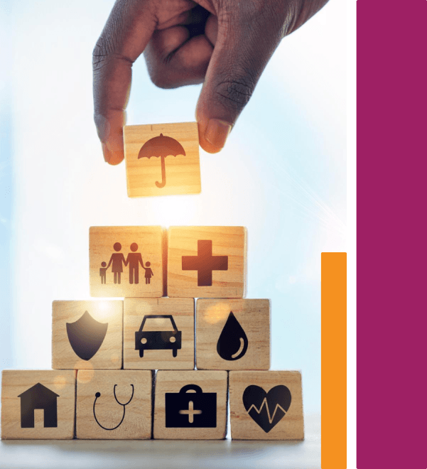 Hand placing umbrella insurance block on a pyramid of wooden blocks with insurance icons
